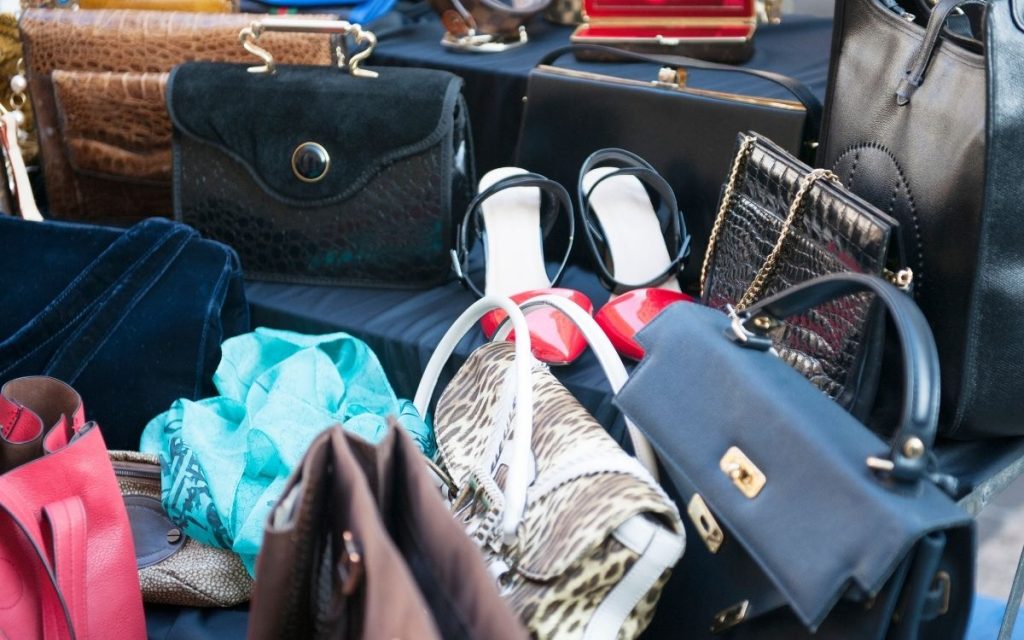 pile of purses at thrift store